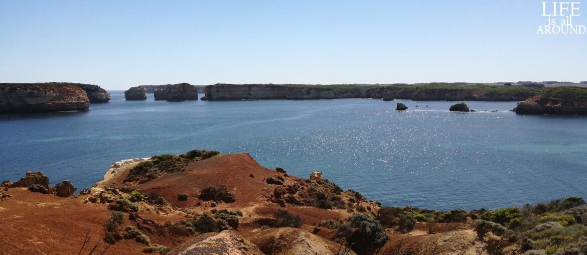 A photo from the Great Ocean Road showing the view from the water in a rocky environment that looks as if the water is trapped in it.