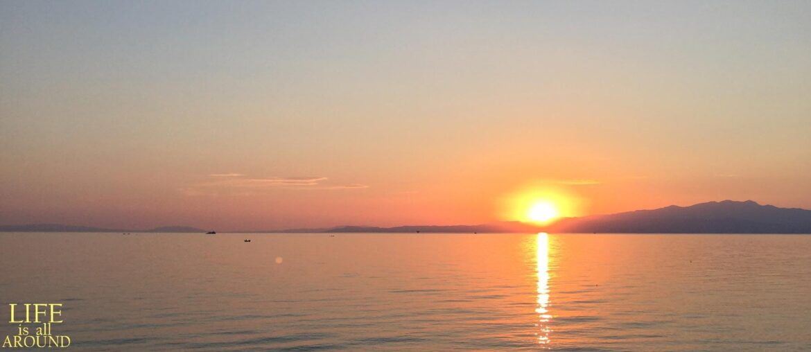 Building Rapport : Mirroring Sunset in Plaka Thassos in the end of a hot day in summer 2017